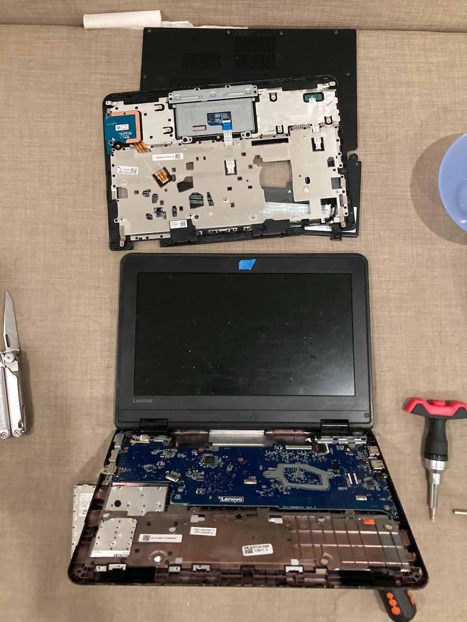 My ThinkPad laptop taken apart, with parts strewn