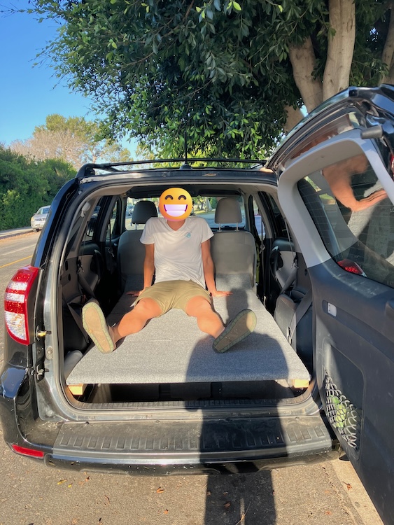 Carpeted camping platform, fitted and installed in the back of a RAV4