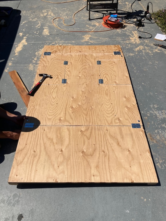 Cut plywood with hinges attached