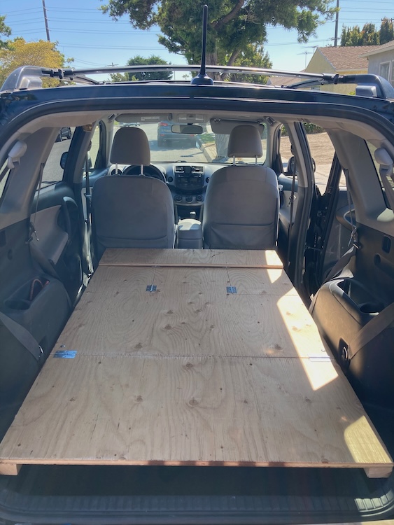 Plywood platform fitting perfectly in the cargo area of a RAV4